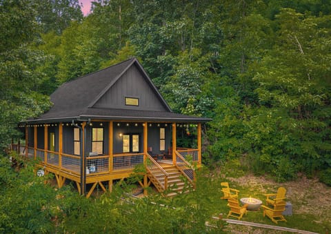 Relax outdoors with a firepit, Adirondack chairs, and cabin charm.