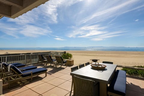 Beachfront Patio with Ample Seating and Sweeping Ocean Views