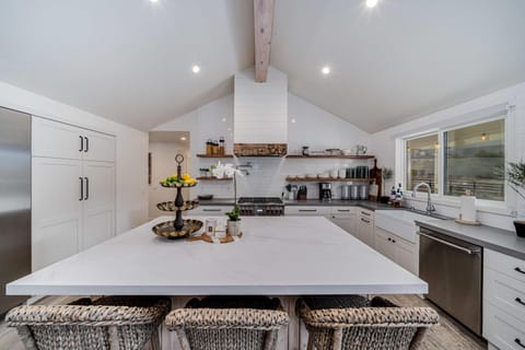 Bright, spacious kitchen with modern farmhouse charm and island seating