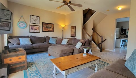 Large comfy couch in the living room with 60 inch TV and google TV