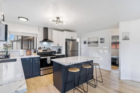Seating for three & extra stools in the office room.