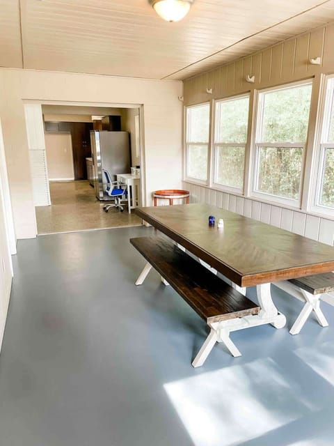 Sunroom dining area with table that seats 8. 