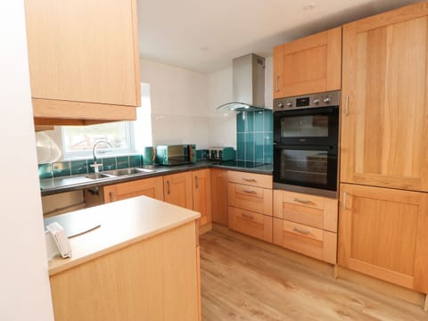 Fridge, electric kettle, toaster, cookware/dishes/utensils