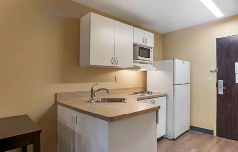 Studio, 1 King Bed, Non Smoking | Private kitchen | Full-size fridge, microwave, stovetop, coffee/tea maker
