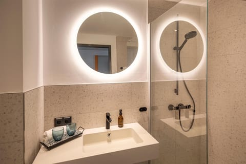 Shower, rainfall showerhead, hair dryer, towels