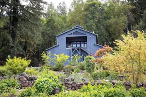 The Barn house perched above 1-acre garden