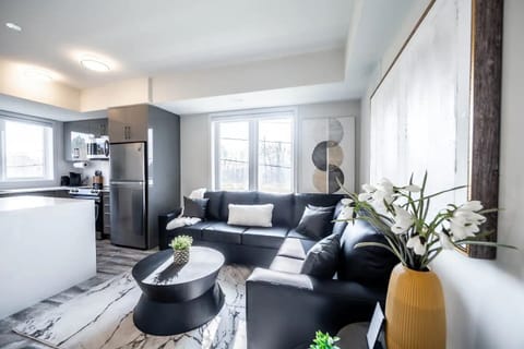 The living room has an oversized sectional sofa with a pull-out double bed.