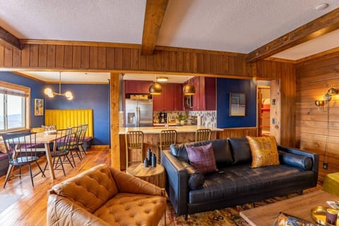 Living and dining in style with this bold and professionally designed space.