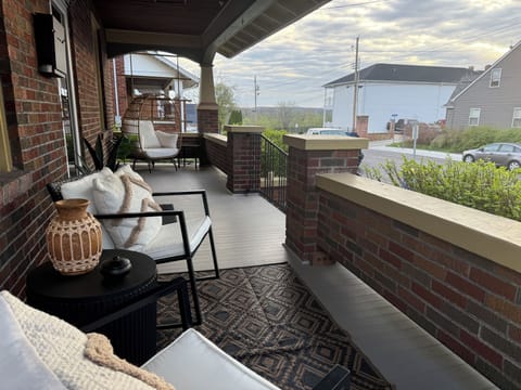 Enjoy a cocktail on the front porch! The neighborhood is safe & serene.