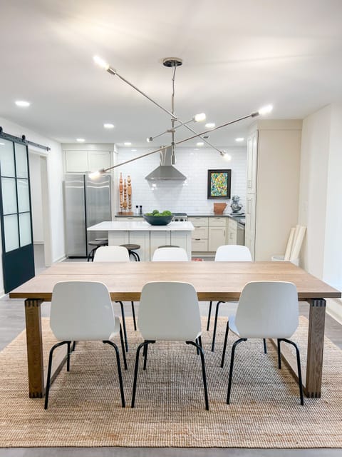 Open floor plan with dining area separating kitchen and living room.