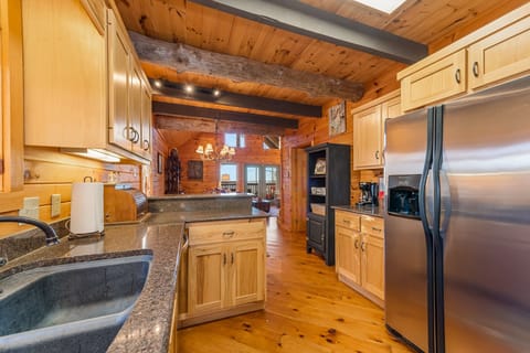Kitchen looking to dining area and living room