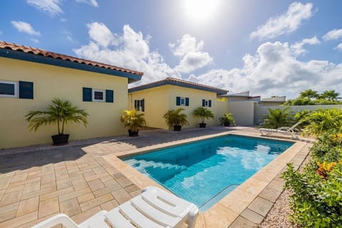 Enjoy your day with this crystal blue outdoor swimming pool.