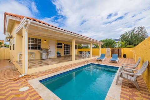 Swim in the privacy of your own backyard. There is also a BBQ area by the pool and additional seating.
