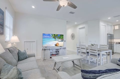 Looking Towards the Dining Room and Kitchen; The Door In the Hallway Leads to the Garage