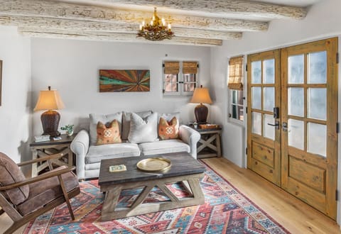 large living room with French door that open to patio for outside dining
