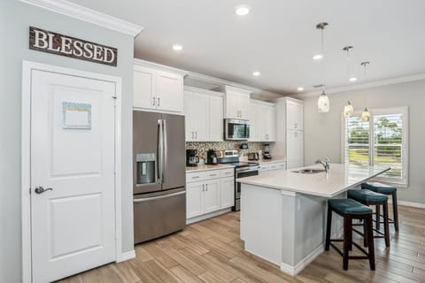 The kitchen bar is a great spot for morning breakfast or afternoon snacks