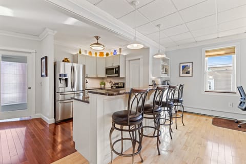 Enjoy an open-concept kitchen with full-sized breakfast bar.