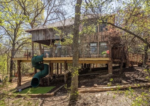 Your treehouse is in the middle of a forest and 15 feet off the ground!  Check out that spiral slide!