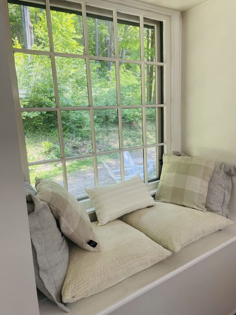 Curl up in the window seat and watch birds and deer in the meadow!