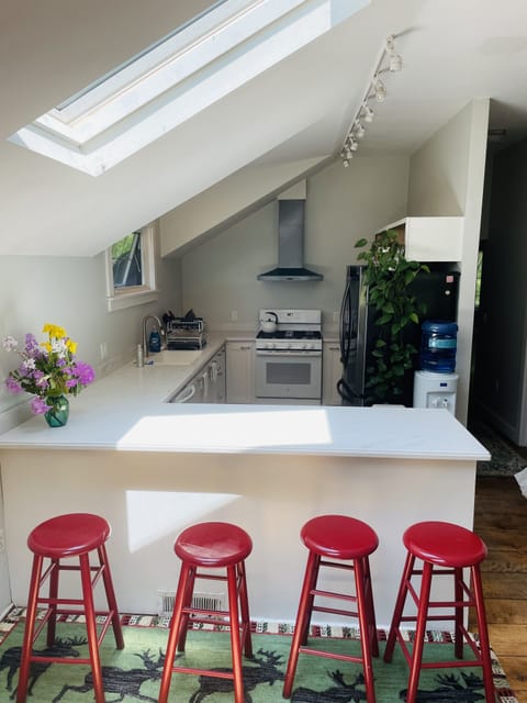 Well-stocked, cheerful kitchen is open to the great room.  Visit while you cook!