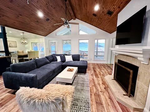 Directly on the lake with a private dock and fully fenced-in waterfront backyard