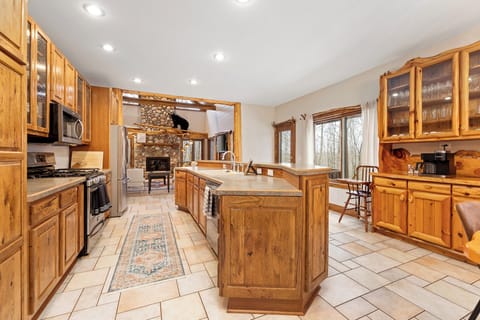 Spacious, fully equipped kitchen with large island—designed for cooking, gathering, and sharing meals together.