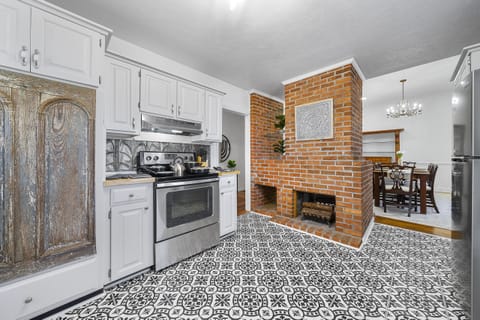 Prepare your family's meals in this unique kitchen designed with antique pieces.