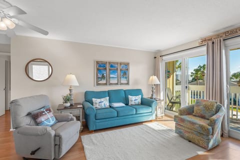 Sink into this bright living room where coastal charm meets comfort—your perfect retreat after beach days awaits.