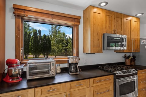 Full kitchen with drip coffee maker.