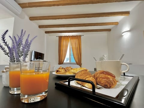 Family Apartment | Living area | 50-inch flat-screen TV with cable channels, TV, toys
