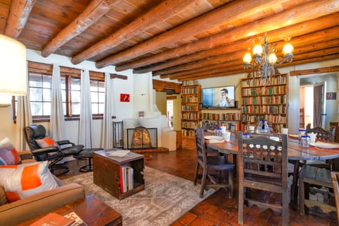 A living room with a fireplace and bookshelves.