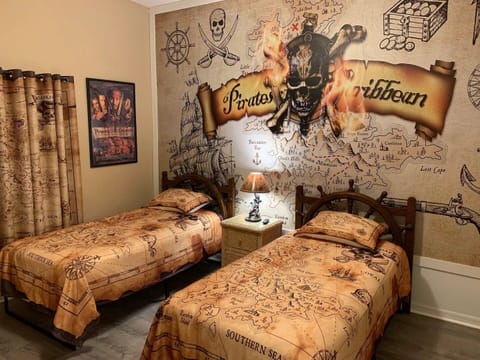 Pirates of the Caribbean Bedroom with Two Twin Beds and Flat Screen TV