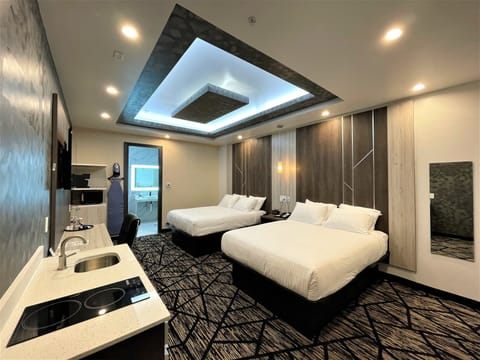 Standard Room, 2 Queen Beds, Non Smoking, Kitchenette | Desk, laptop workspace, blackout drapes, iron/ironing board