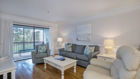 Living Room with pull out sofa, recliner, and 55" smart TV