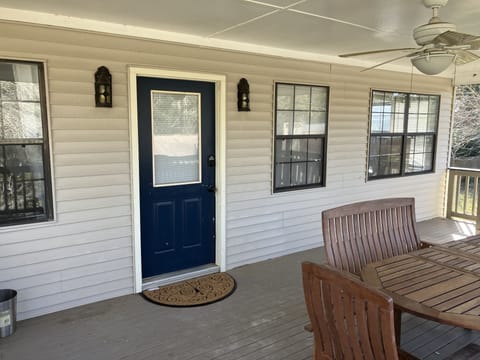 Porch of VRBO Unit in Daphne, Alabama with outdoor dining table