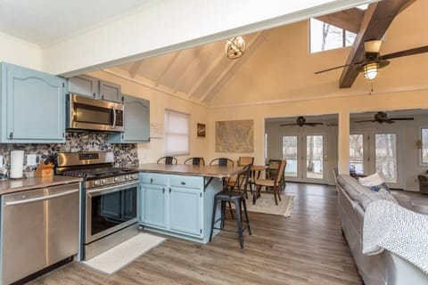 This charming river house features an open-concept living and kitchen area, perfect for gathering and relaxing. Enjoy gorgeous views of the river from every corner, creating a serene and tranquil atmosphere for your stay