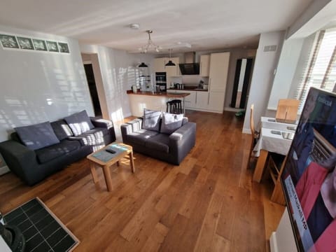 Large open plan lounge/kitchen and dining space. 