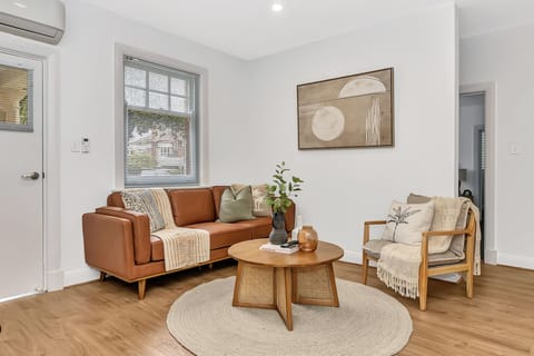 Relax in our inviting living area with AC for a pleasant stay.