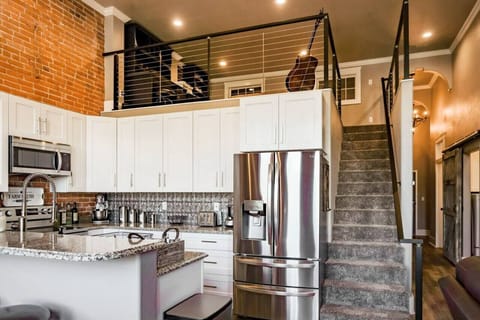 Stairs lead to loft with office and a fold-out full-size bed for additional sleeping space.