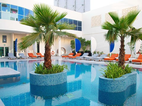 Outdoor pool, pool umbrellas, sun loungers