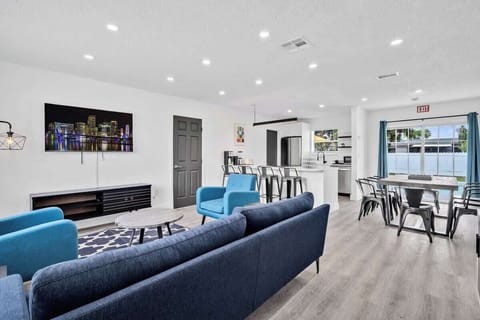 Enjoy this spacious open-concept layout with stylish seating, modern kitchen, and natural light — perfect for group stays.