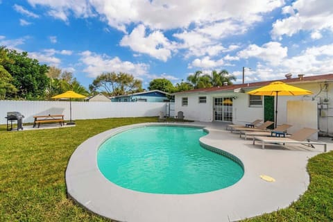 Grill and chill! This backyard blends poolside fun with BBQ vibes — ideal for family gatherings.