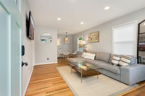 Bright open living area with hardwood floors and plenty of room to relax