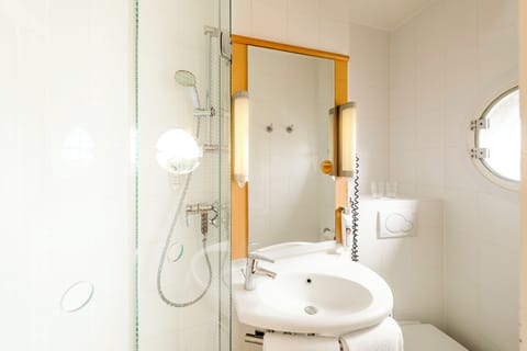 Shower, eco-friendly toiletries, hair dryer, towels