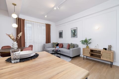 Another angle of the living room showcasing the spacious layout and décor.