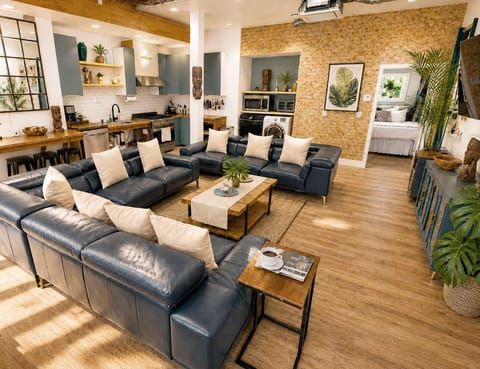Open-Concept Living Room Featuring 4 Sofa Beds, Expansive Seating, and a Comfortable Resort-Style Layout — Ideal for Lounging, Social Time, and Extra Sleeping Space