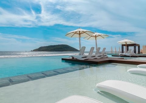 Outdoor pool, open 8:00 AM to 9:00 PM, pool umbrellas, sun loungers