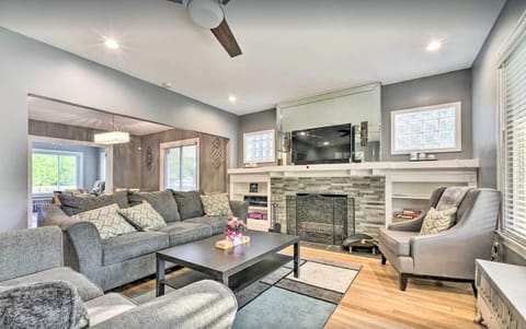 Open-concept living room with comfortable seating and natural light