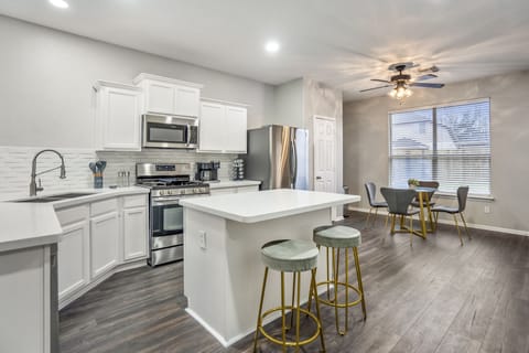 Sleek finishes and top-tier appliances define this stylish kitchen.