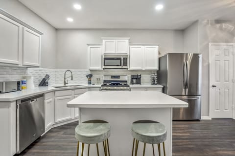 Our modern kitchen boasts high-end appliances and chic design.